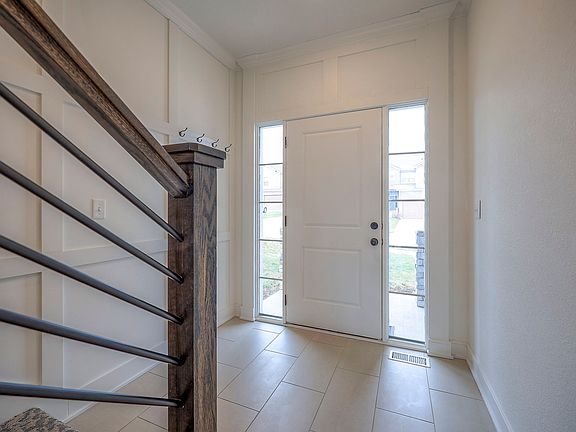 Additional coat hangers in entryway.