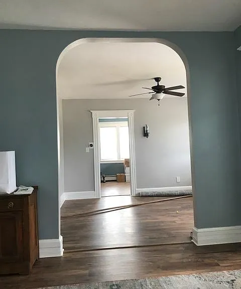 Living Room view into Dining Room and Kitchen.