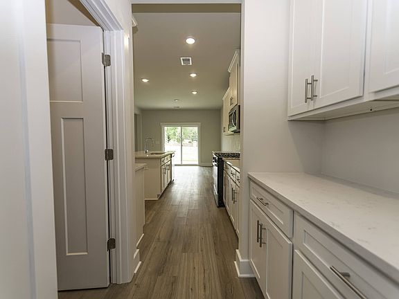 Prep dinner in the kitchen while entertaining.