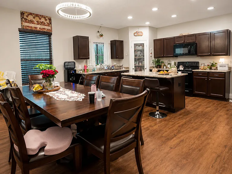 inside the cozy kitchen and bar space. Marbeled island and space for a table of 12.