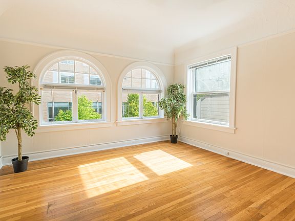 The Palladian ; Sun Filled Arched Windows in Living Room