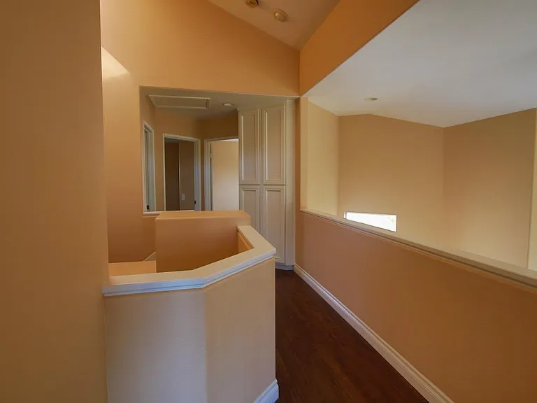 Hallway view from the master bedroom. Linen closet across from bathroom #2