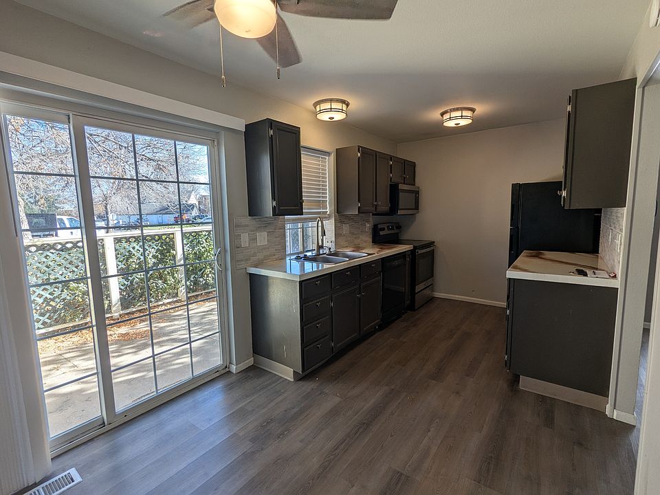 Kitchen and additional dining area. Sliding door accesses private patio.