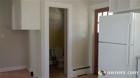 Kitchen looking at side door and 1/2 bath