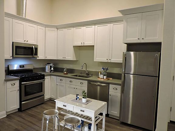 Stainless steel appliances, solid wood cabinets and quartz counter tops