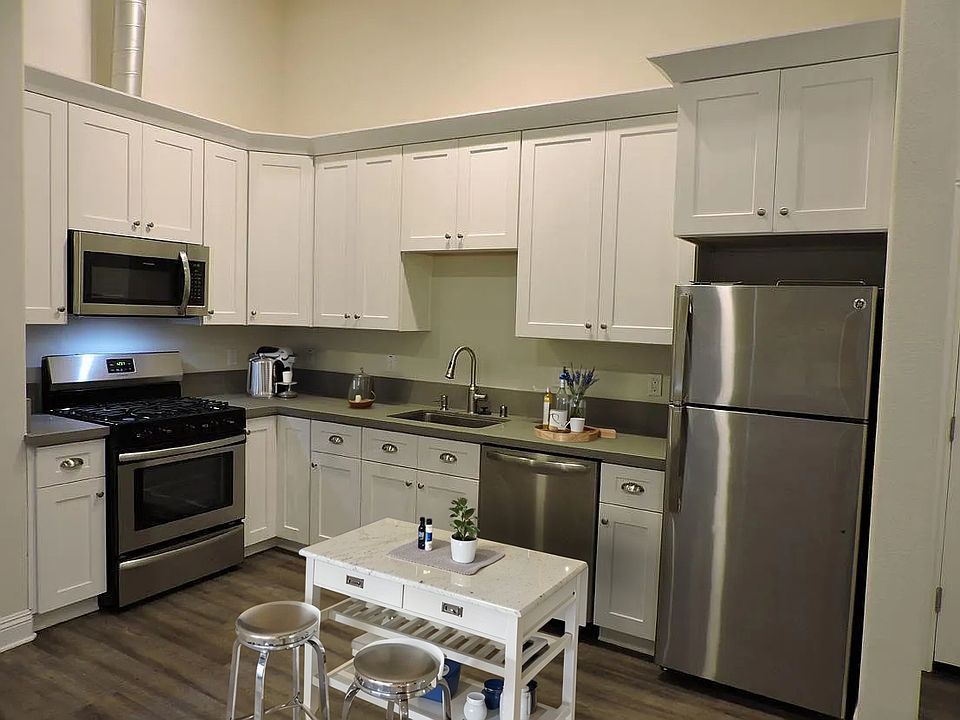 Stainless steel appliances, solid wood cabinets and quartz counter tops