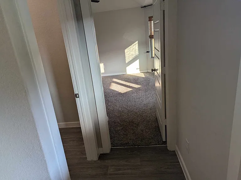 entrance to master bedroom, laundry room to the left