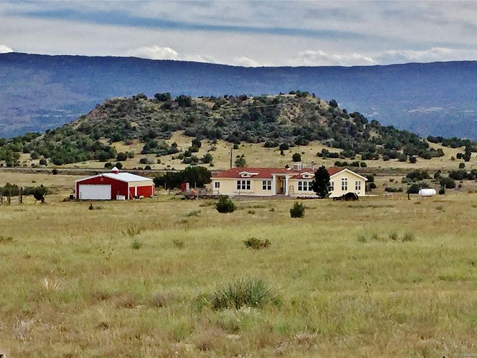 It's worth the drive to check out this ranch-style home with garage, barn, loafing shed, fenced and cross-fenced!