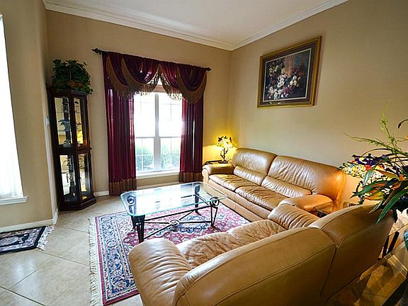 On the other side of the foyer is a formal living room.