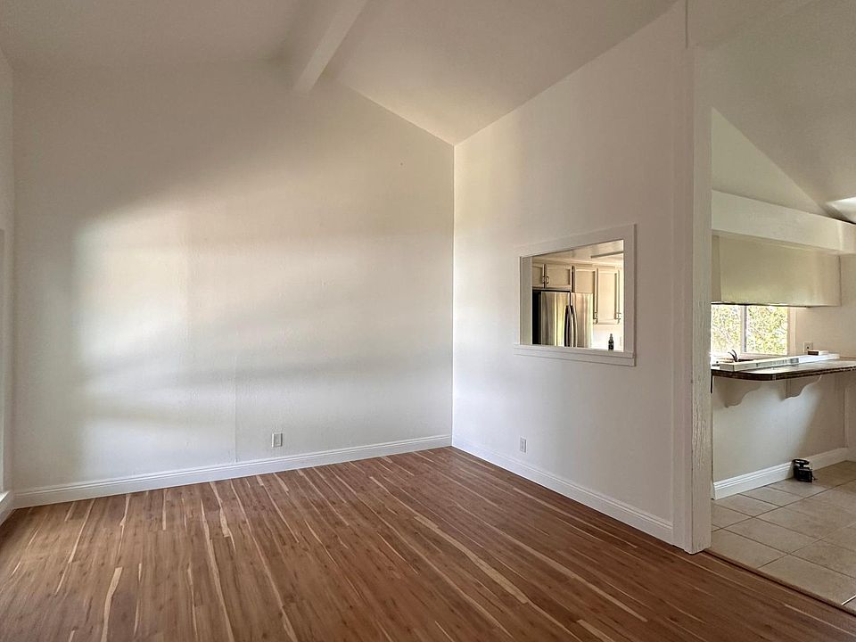 Living Room - High ceilings, plenty of natural light and has gas fireplace.