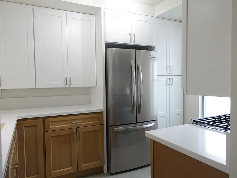 Kitchen: Counter-depth Refrigerator/Freezer with interior filtered water dispenser. Overhead storage with sliding shelf. Pantry cabinet.