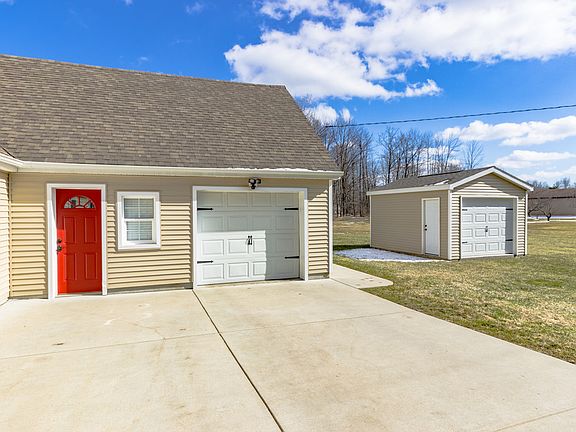 Single car garage and door leading to mudroom.  Garage has lots of storage space underneath the stairs.  There is also a 12 x 16 ft shed with cement floor to store lawn mower, snow blower and still have room for your outside toys.