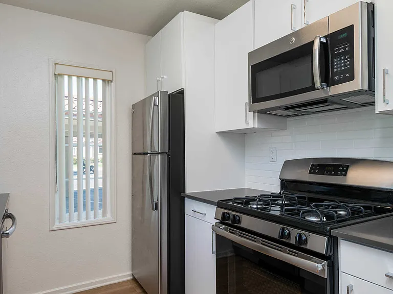 Kitchen with Stainless Steel Appliances and Quartz Countertops