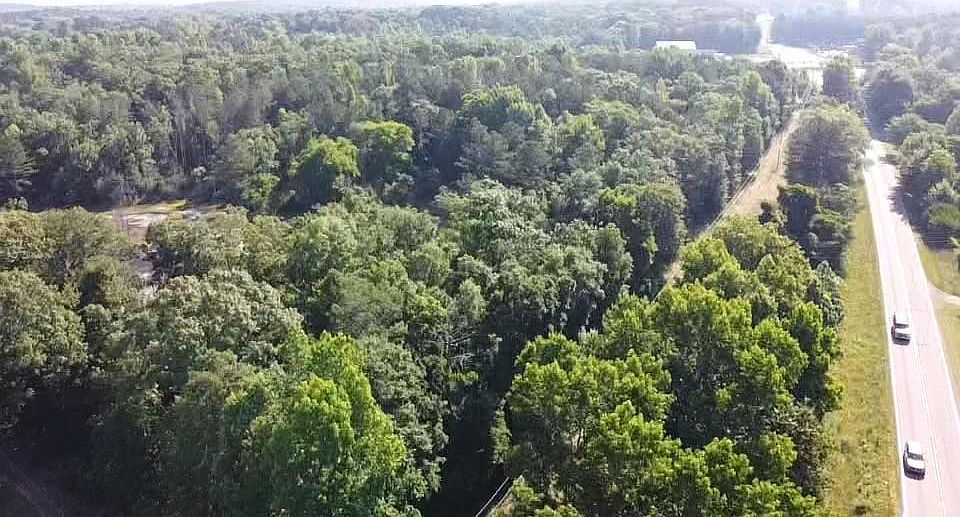Looking West over property down Fairview Rd.