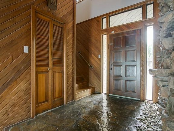 Stone Entry way with Gorgeous stone wall!