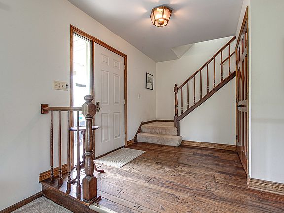 Front hall closet and open to Living ROom