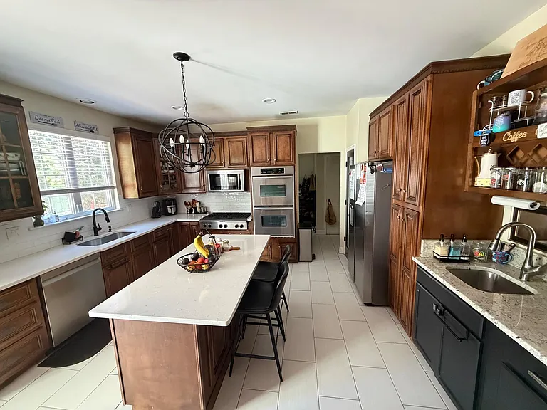 Kitchen includes coffee station (second sink), new quartz counters