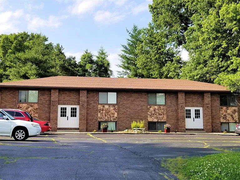 Front view of building. 4 units within each outside door.