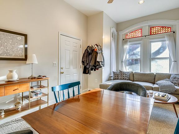 The unit is located on the main level, and features 12 foot ceilings, stained glass windows.