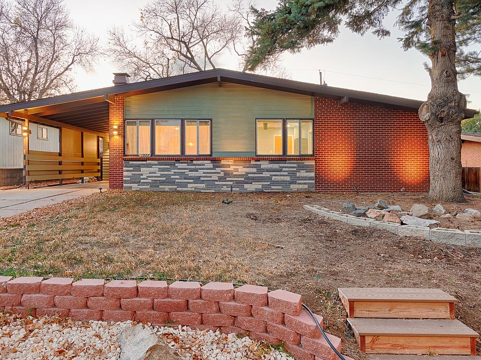 Front of Home with landscape lighting.