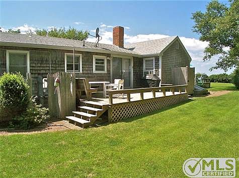 Side/Rear view with yard and two decks.