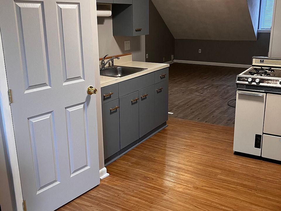 Dinning room into living room, airy and open. New floors.