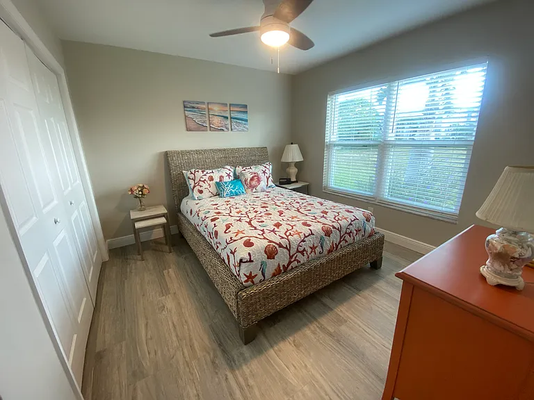 Guest bedroom, queen bed, oversized closet, large hurricane impact windows
