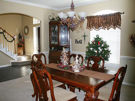 The formal dining room will accommodate your large dining furniture; has crown molding and chair rail.