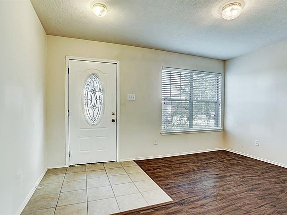 There is a ceramic tile foyer and Formal Living room has a double window that overlooks the front of the home.