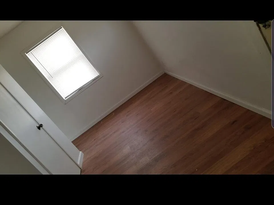 Hallway leading to kitchen and garage.