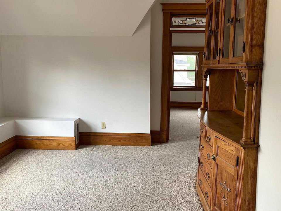 Dining room w/built-in hutch; double windows to the left out of photo; view to office/study/guest room