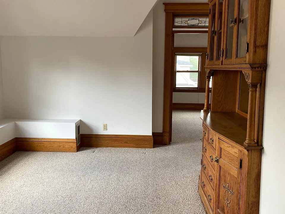 Dining room w/built-in hutch; double windows to the left out of photo; view to office/study/guest room