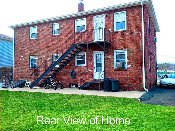 The rear of propert showing the stairway to second floor kitchen entrance.