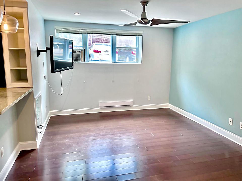 Living room with wall-mounted TV