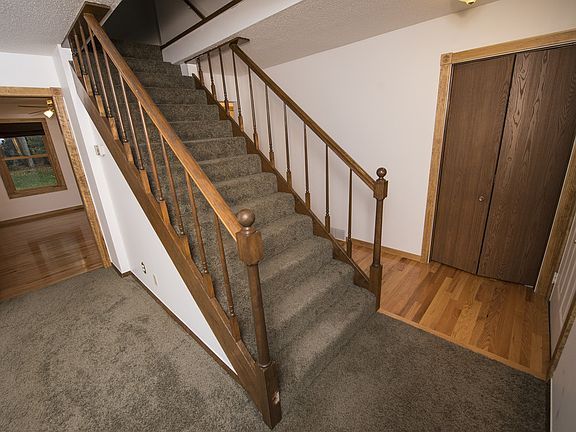 Front entry leads into the living room with beautiful stairway leading up to the second level with 2 full bedrooms and full bathrooms are located.