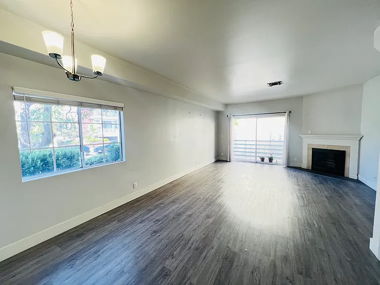 Dining area to living room with fireplace