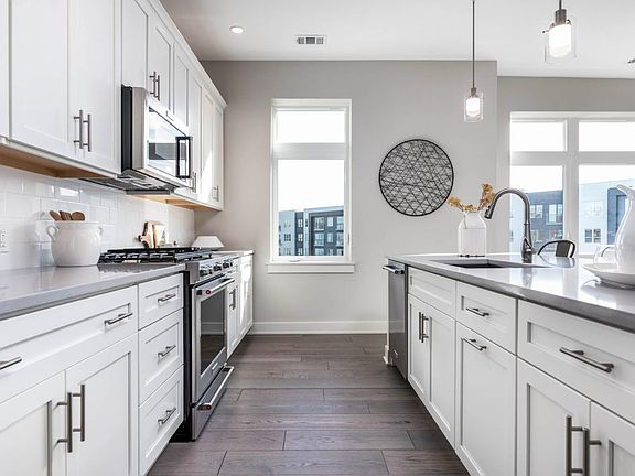 Well-Appointed Kitchen Features Name-Brand Appliances and Quartz Countertops