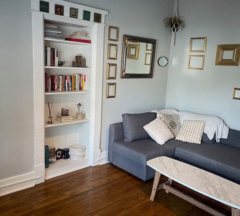 Built-in bookshelf/storage in the living room.