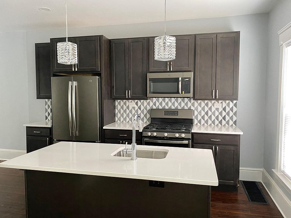 Brand New Custom Kitchen! Slate appliances, soft close cabinets, quartz counters, marble/steel backsplash.