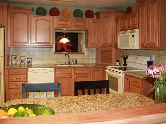 Spacious kitchen with Maple cabinets and granite countertops