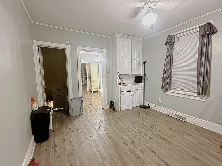 dining room to basement door and second living room view