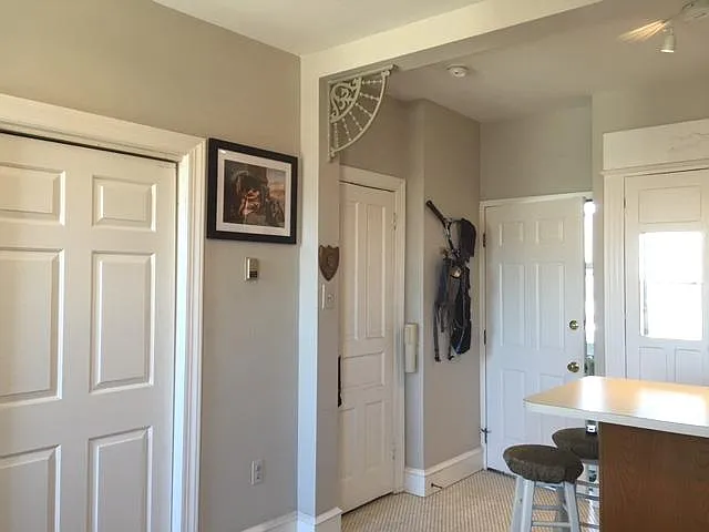 Studio Apartment, Closets & View to Apartment Entrance