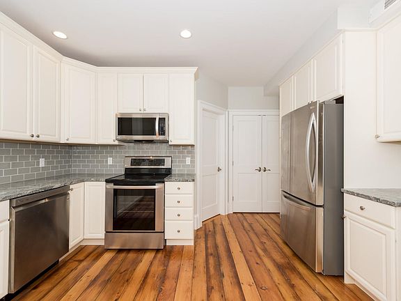 Granite Countertops and Glass Subway Tile Backsplash