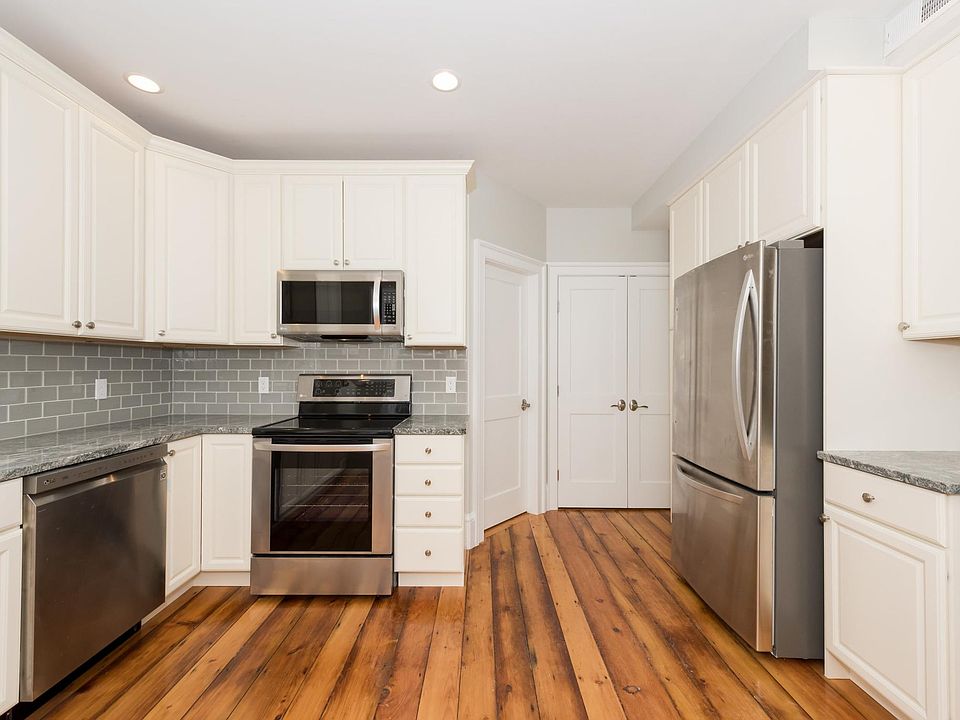 Granite Countertops and Glass Subway Tile Backsplash