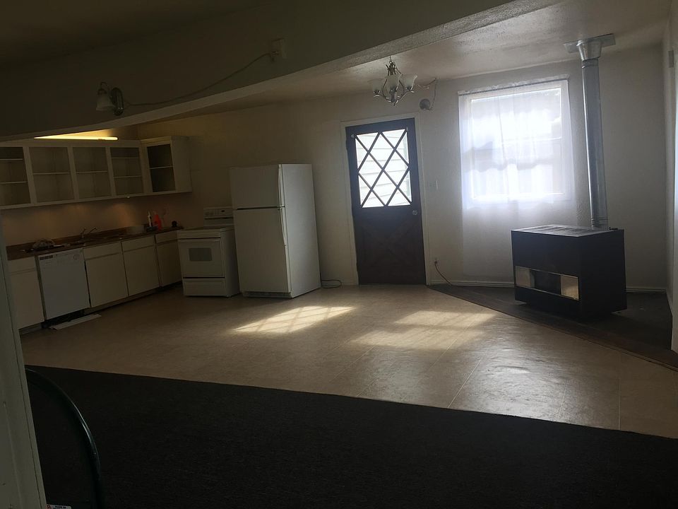 View from the Southern bedroom facing the Main/East Door, showcasing the open floor plan.