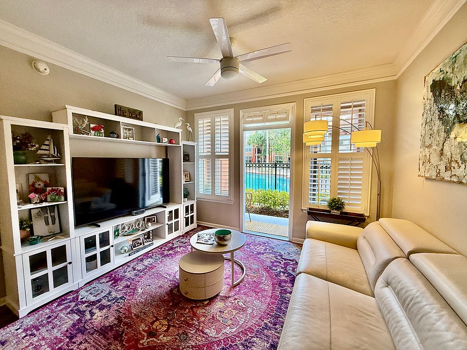 Enjoy the spacious two bedroom two bath condo available fully furnished or bring your own furniture steps to the pool literally located in the heart of St. John's Town Center behind Maggiano's little Italy
