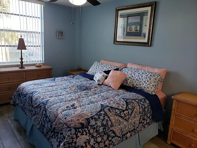 MBr with king size bed, dresser, bureau, walk in closet.