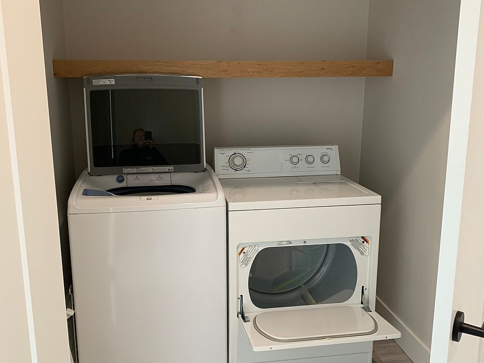 Laundry with full-size washer and dryer.