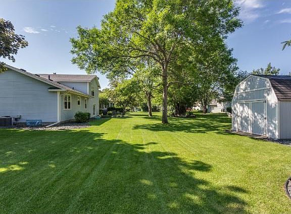 Plush backyard with 10x12 storage shed equipped with 5x12 loft!