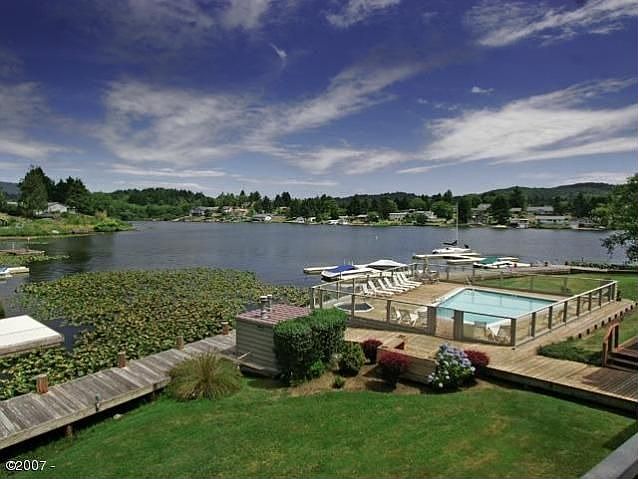 Devils Lake Condominium with a lakeside pool, boat slip & dock